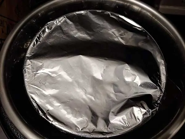 7-inch cheesecake pan topped with aluminum foil inside Instant Pot.