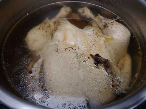 Cooked whole chicken in Instant Pot with broth.