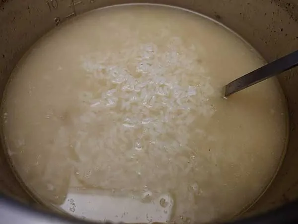 Cooked rice in chicken broth in Instant Pot.