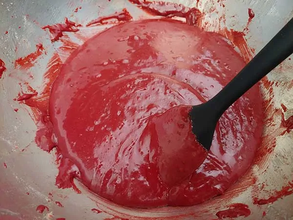 Cake batter fully combined with rubber spatula.