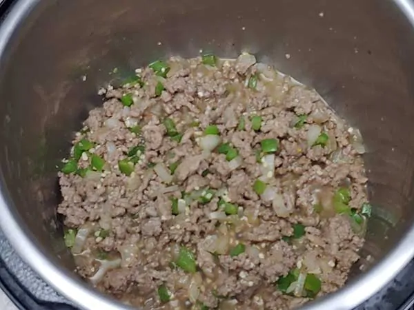 Browned ground beef with diced onions and peppers.