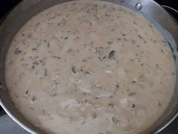 Cream of mushroom soup in pan.