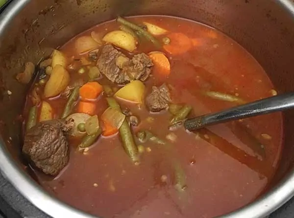 fully cooked soup in Instant Pot with ladle