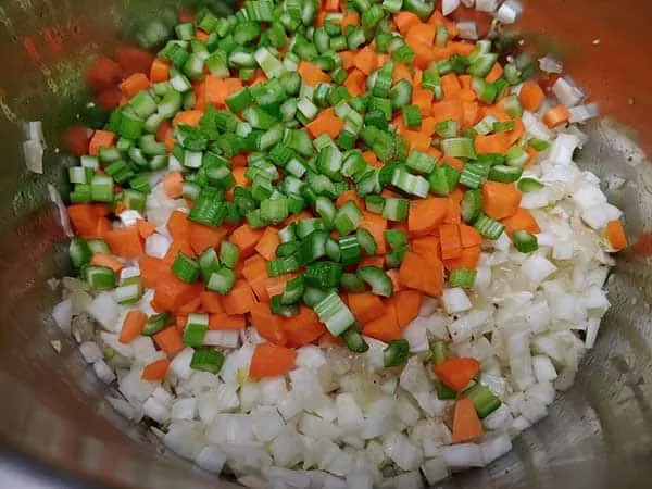 Diced celery carrots and fennel added to pot.