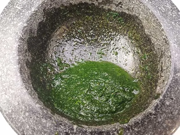 Mint paste in mortar and pestle.