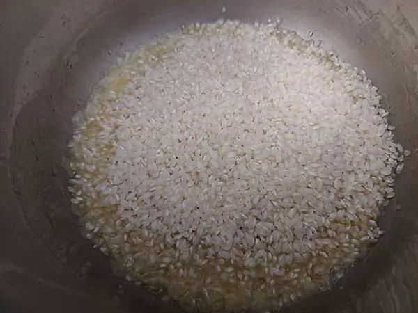Arborio rice on top of sautéed onions.