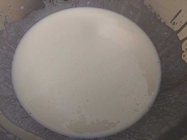 Buttermilk and eggs whisked together in mixing bowl.