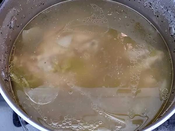 Fully cooked turkey stock in pot.