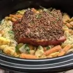 Slow cooker corned beef with cabbage, potatoes, and carrots.