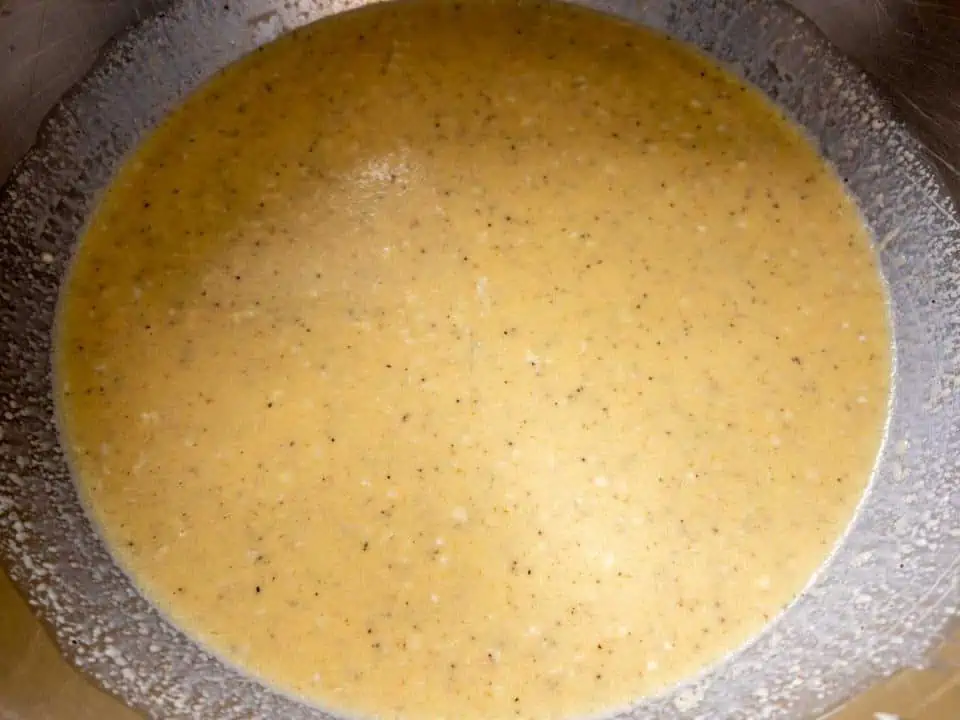 beaten eggs and evaporated milk with seasonings in large mixing bowl.