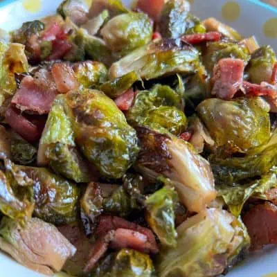 Maple Bacon Brussels Sprouts in a white bowl with yellow polka dots.