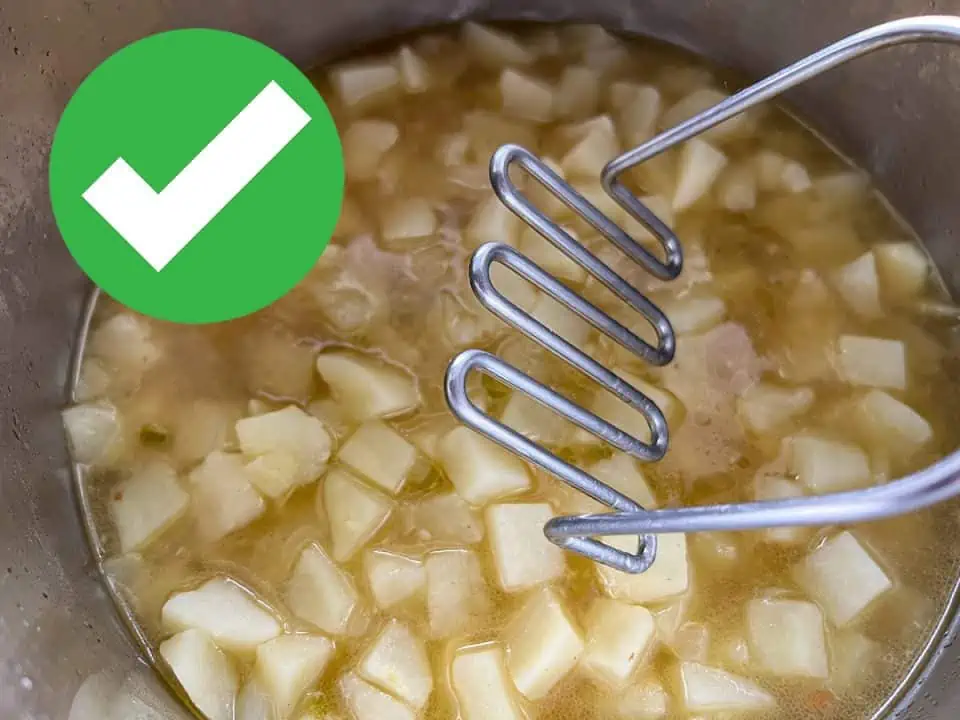 closeup of a potato masher with cooked potatoes in the background with a green checkmark in the top left corner.