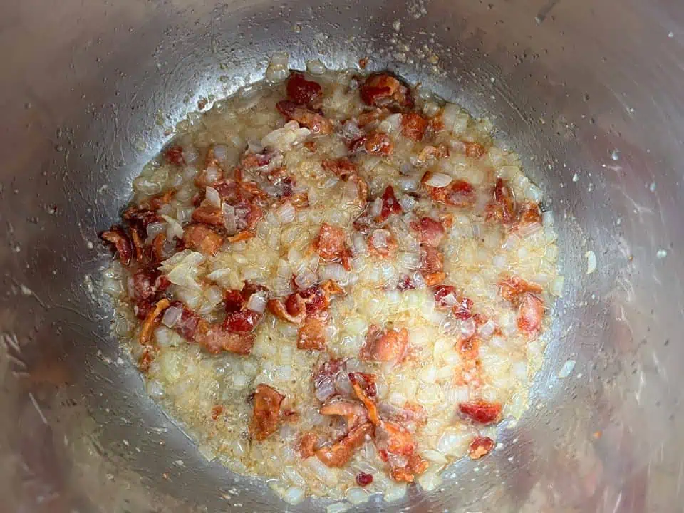 Crispy bacon and sauteed diced onions in an Instant Pot.