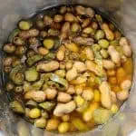 Cooked boiled peanuts with pickles, jalapenos, and olives in Instant Pot.