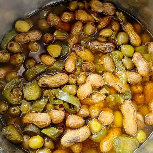 Cooked boiled peanuts with pickles, jalapenos, and olives in Instant Pot.