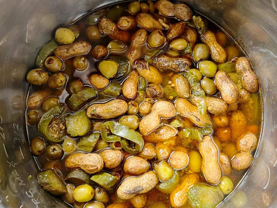 Cooked boiled peanuts with pickles, jalapenos, and olives in Instant Pot.