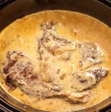 Crock Pot pot roast with cream of mushroom gravy—tender chuck roast in rich sauce