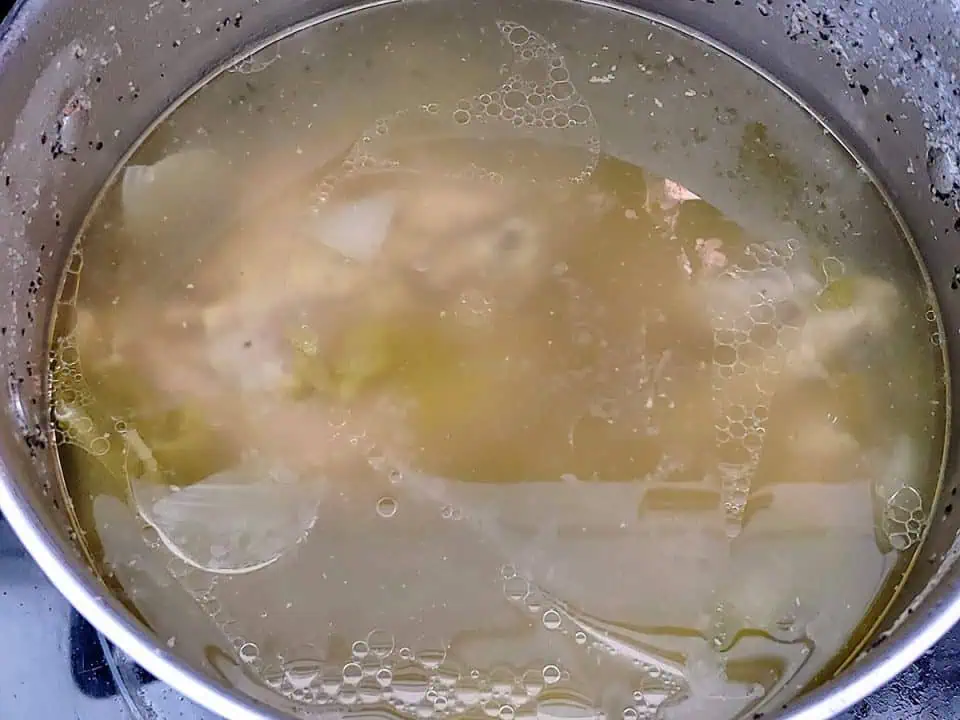 Fully cooked turkey stock in pot.