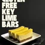 Three easy gluten-free key lime bars with cheesecake and lime curd layers on a white plate against a dark background.