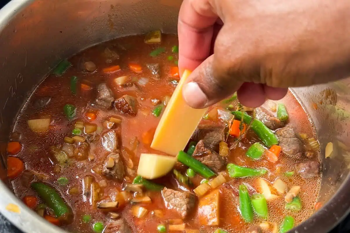 Adding a parmesan rind to vegetable beef soup before cooking