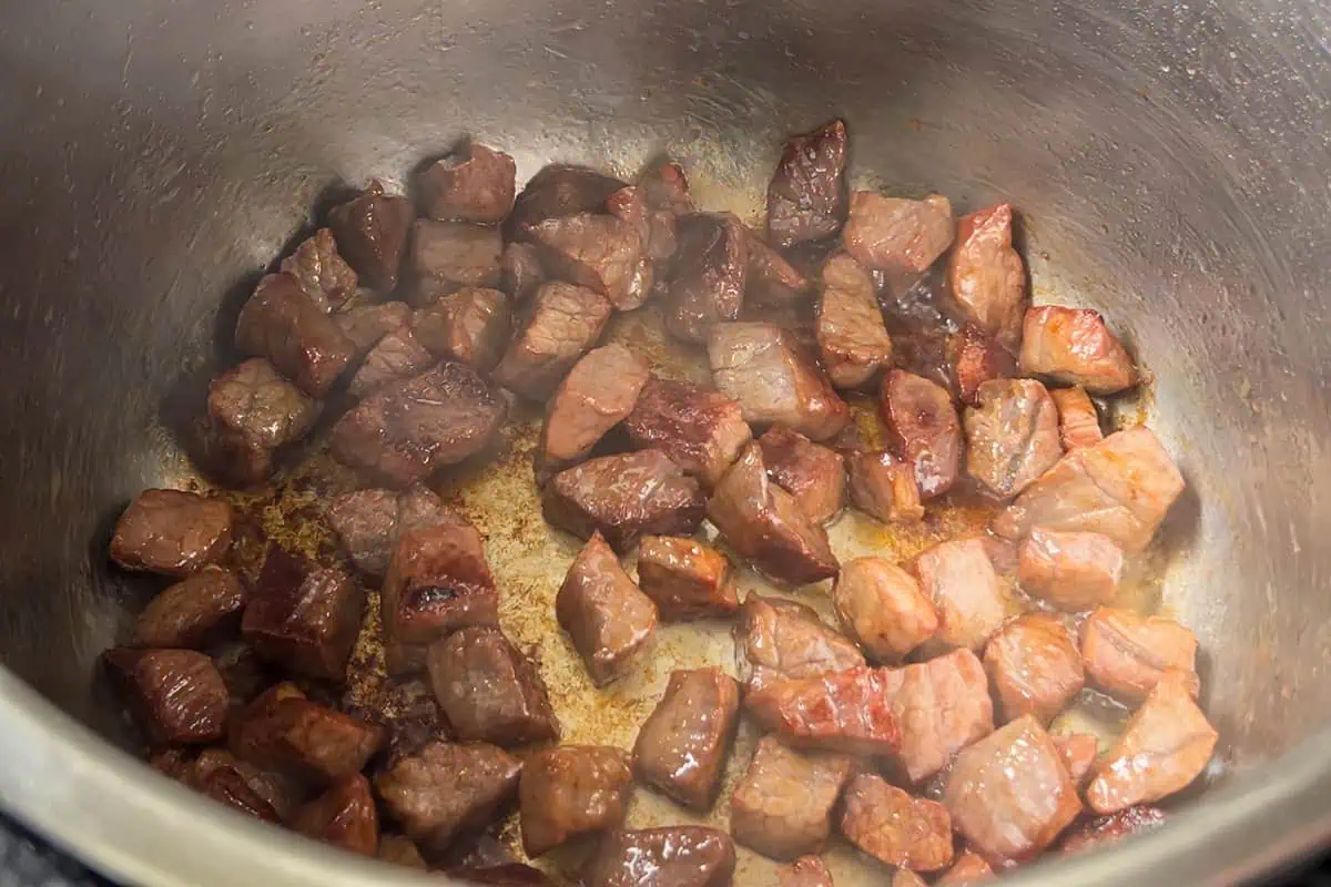 Browning cubes of beef in an Instant Pot for vegetable beef soup