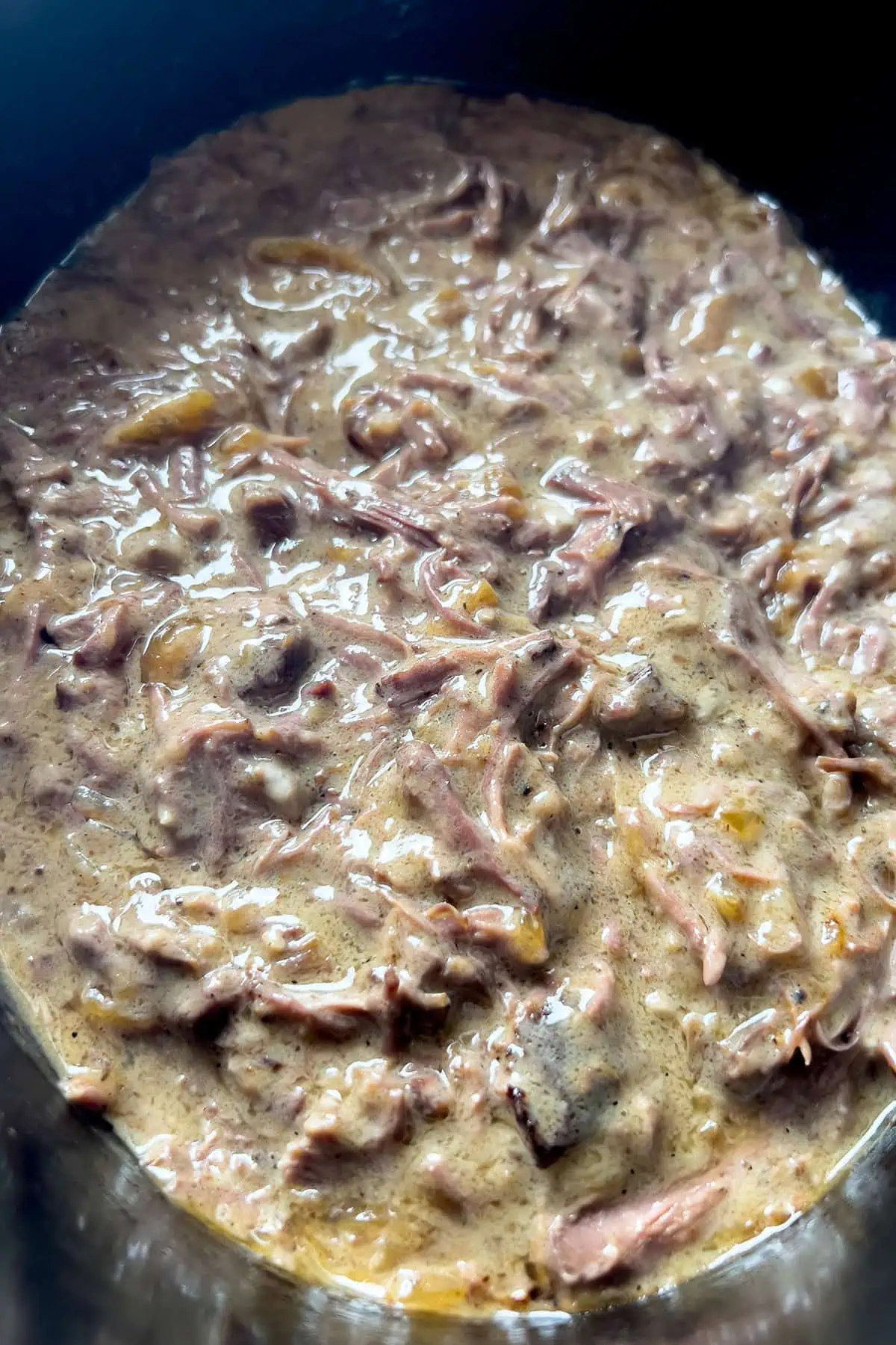 Shredded Crock Pot pot roast folded into silky cream of mushroom gravy