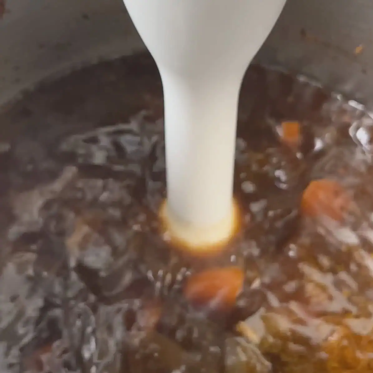 Defatted lamb shank broth and cooked aromatics in the Instant Pot before blending into sauce.