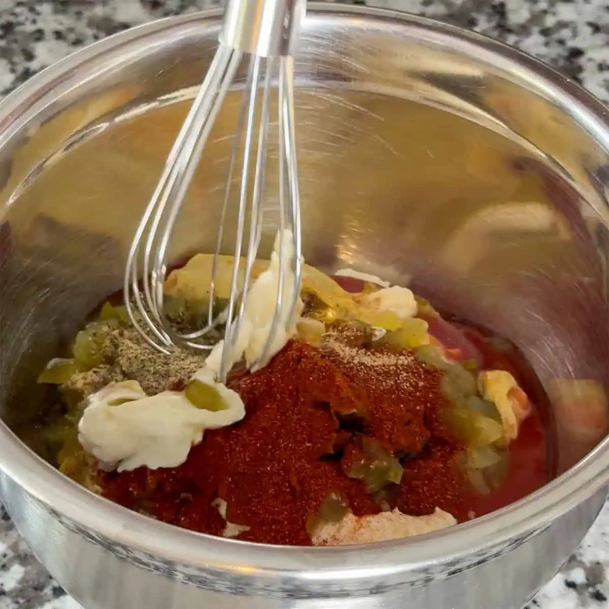 Mayonnaise, ketchup, mustard, relish, and spices in a bowl for making Gary Sauce