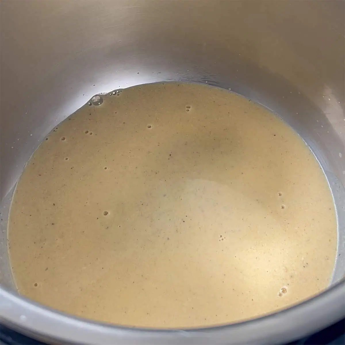 Warm evaporated milk, butter, and seasonings in the Instant Pot