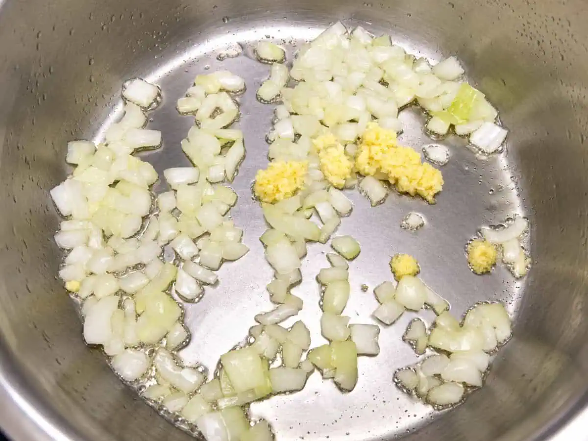 Fresh ginger and garlic added to sautéed onions in the Instant Pot.