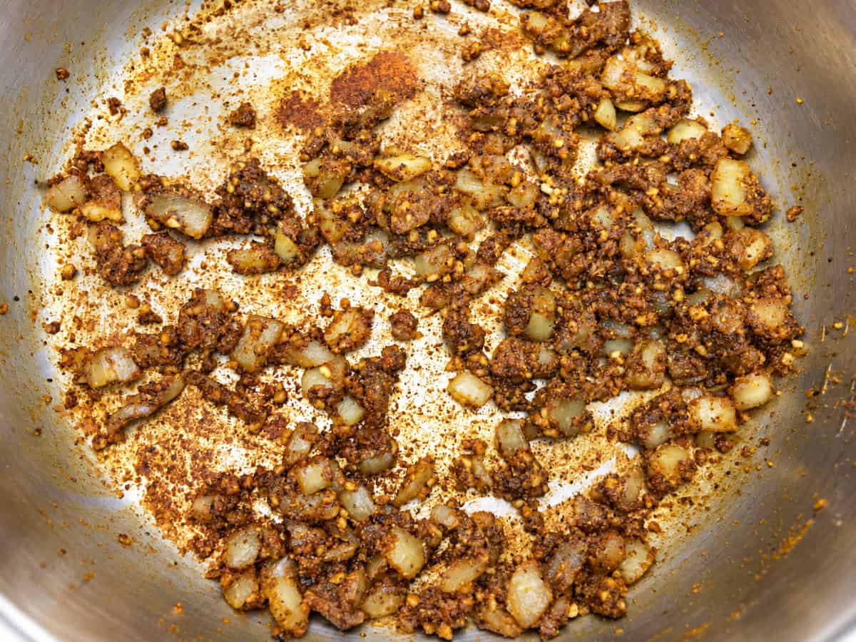 Curry powder toasted with onions, ginger, and garlic in the Instant Pot.
