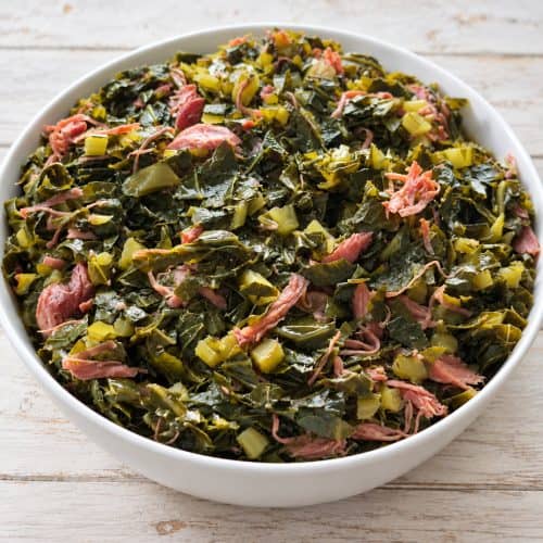 Southern collard greens with smoked turkey and bacon in rich pot liquor.